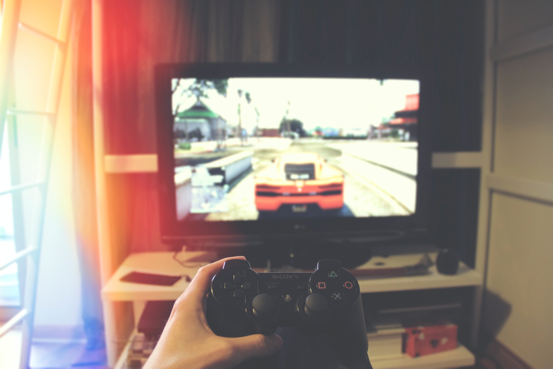 A player playing GTA V with the PlayStation 3.